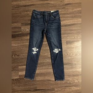 Distressed blue jeans